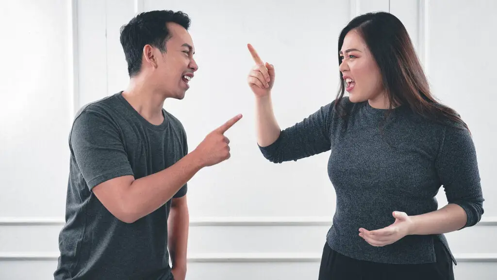 This image shows a couple arguing and it's used in the article "why does my girlfriend get mad so easily" 