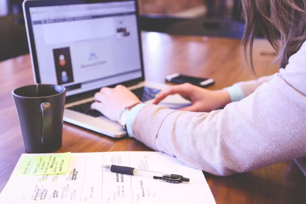 This is an image of a woman being busy with her work. This image was used in the article, My Girlfriend Doesn't Want To Get Married (10 Reasons Why) 