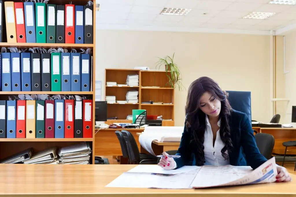 This image shows a woman at work and is busy. 