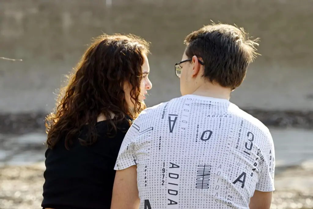 This image shows a man actively listening to his girlfriend. It's used for the article, "My girlfriend doesn't text me like she used to" 