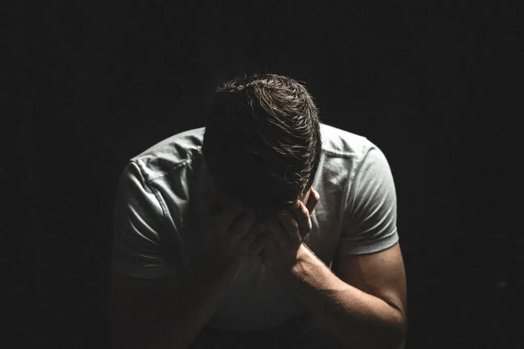 This image shows a man struggling with his emotions. It's used for the article, My boyfriend doesn't know how to comfort me 