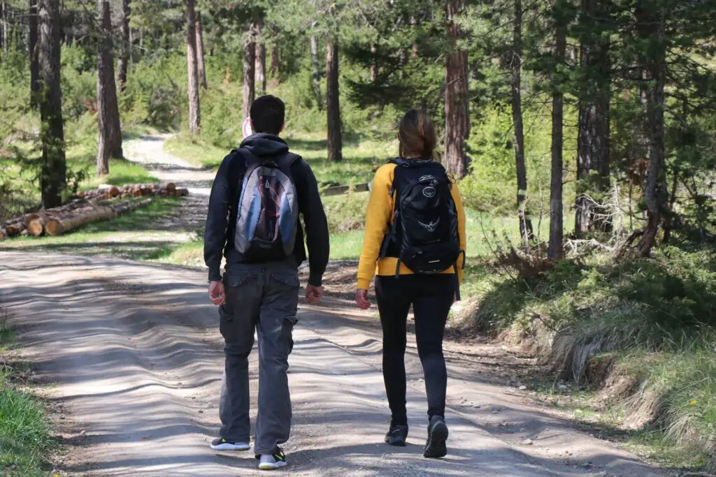 This image shows a couple on a hiking date. It's used for the article, Why is my boyfriend a different person when he's drunk