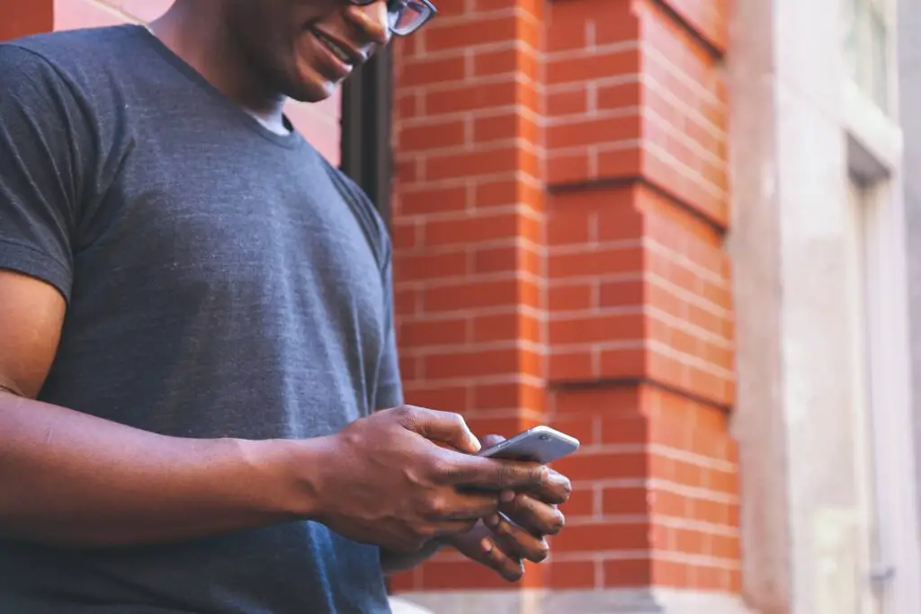 This image shows a man texting. It's used for the article, "good morning message for long-distance couple" 