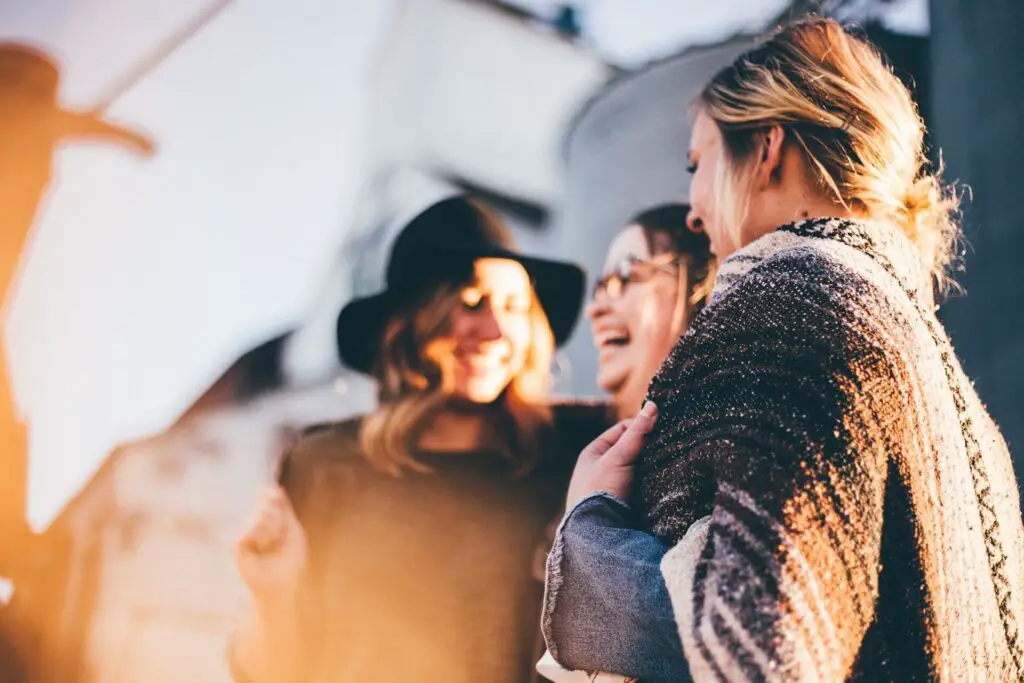 This image shows a group of friends hanging out and laughing. It's used for the article, "Long-distance relationship break-up"