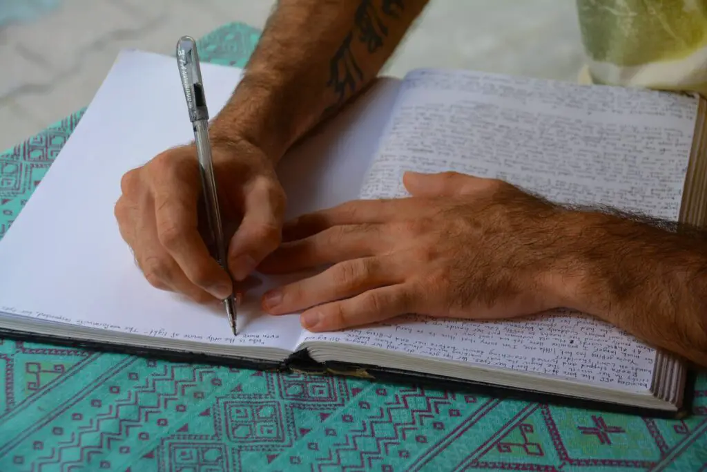 This image shows someone journaling. It's used for the article "questions to ask on date" 