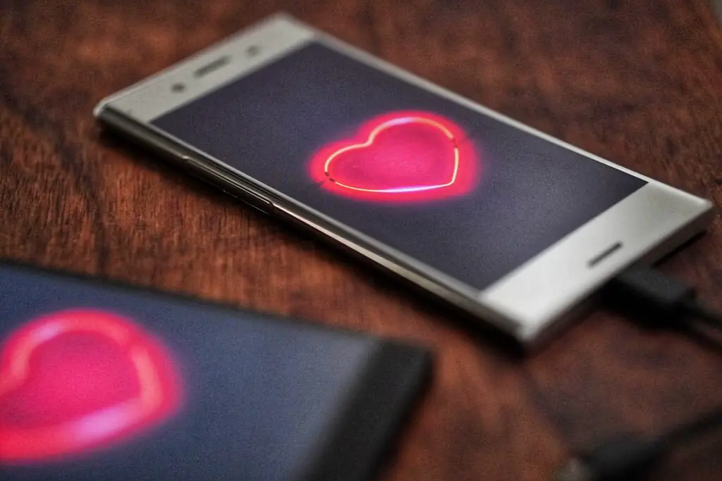 This image shows two phones with a heart on it. It's used for the article, "Dating is hard"